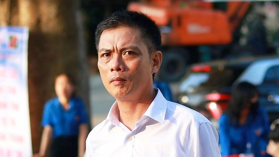 46-year-old Dang Van Anh sit the year's high school graduation exam