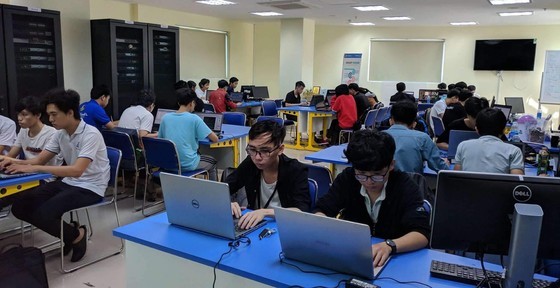 Students of a college in HCMC in their class