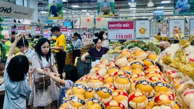 Consumers select items in a supermarket