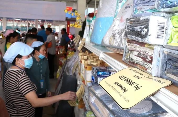 Employees at Pouyuen Vietnam Company look for needed goods