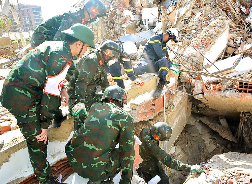Soldiers of Vietnam's search and rescue team make efforts to find victims