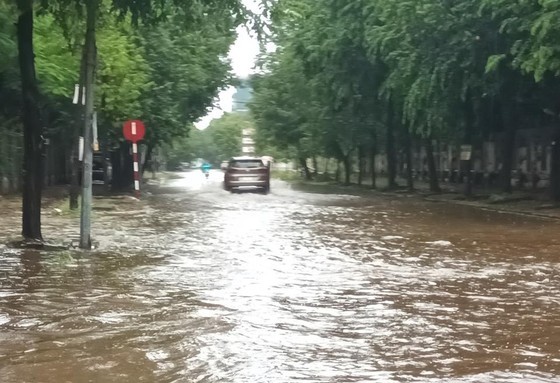 Many streets in the city center are submerged after heavy rains.