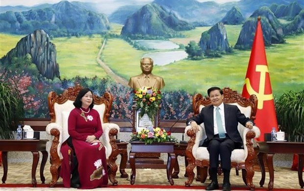 President of Laos Thongloun Sisoulith (R) receives Bui Thi Minh Hoai, Secretary of the Party Central Committee and Chairwoman of its Commission for Mass Mobilization. (Photo: VNA)