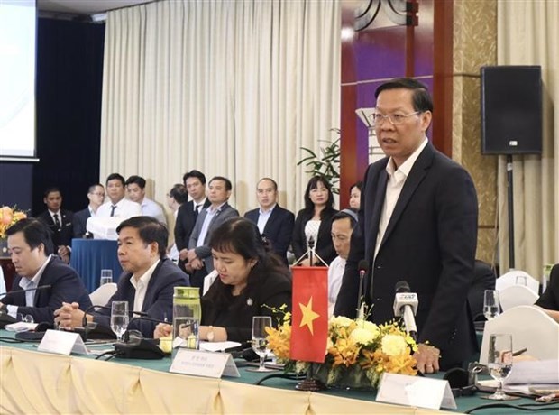 Phan Van Mai, Chairman of the municipal People's Committee speaks at the event. (Photo: VNA)