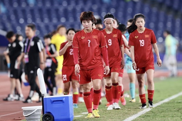 The Vietnamese women's football team loses 0-7 to Japanese rivals in the final match of Group D on September 28. (Photo: VNA) The Vietnamese women's football team loses 0-7 to Japanese rivals in the final match of Group D on September 28. (Photo: VNA)