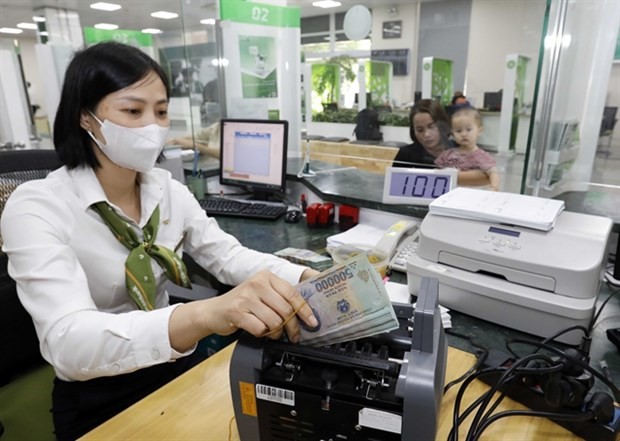Deposits at banks reaches a record high of more than VND6.44 quadrillion as of the end of September, representing a rise of 9.95% against the end of 2022. (Photo: VNA)