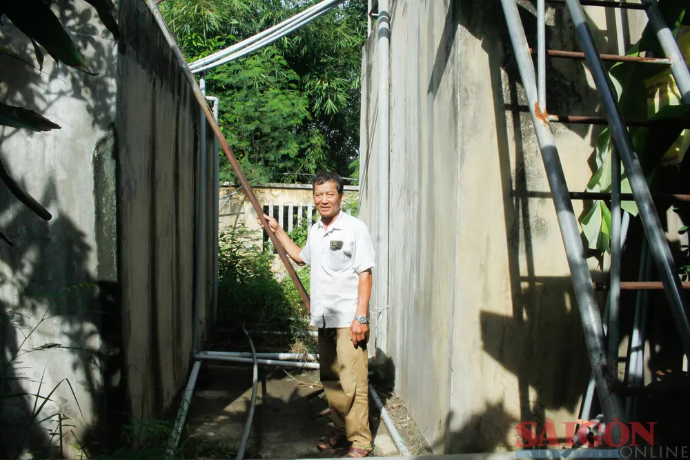 Công trình cấp nước sinh hoạt xuống cấp đã được ông Trần Văn Bảnh sửa chữa, khôi phục hoạt động trở lại. Ảnh: NGUYỄN TRANG Công trình cấp nước sinh hoạt xuống cấp đã được ông Trần Văn Bảnh sửa chữa, khôi phục hoạt động trở lại. Ảnh: NGUYỄN TRANG