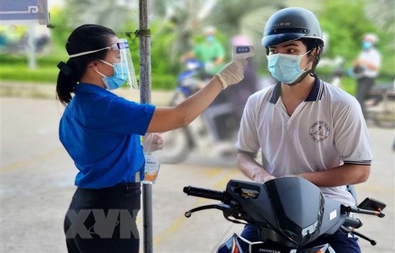 共青團員積極參與本市抗疫工作。（圖源：越通社）