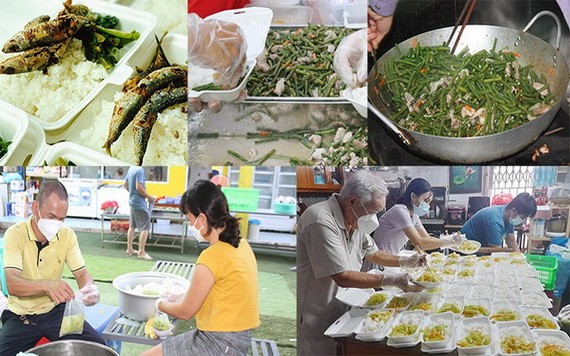 送給抗疫前線工作人員的飯菜充滿了“愛心食堂”志願者的心意。