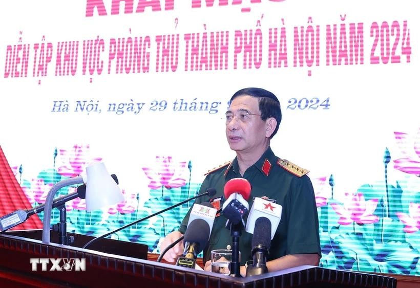 国防部长潘文江大将在开幕式上致词。（图：越通社）