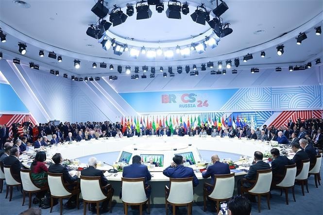 范明政总理出席金砖国家领导人扩大会议全体会议。（图：越通社）