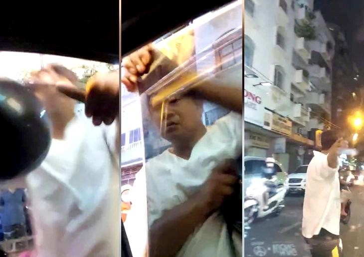 摄像机记录了一名男性在黎鸿峰街上截停一辆汽车并砸毁该车的左侧挡风玻璃，同时还袭击了司机。（图：视频截图）