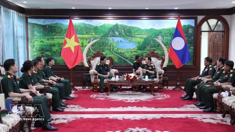 工作会谈现场。图自越通社