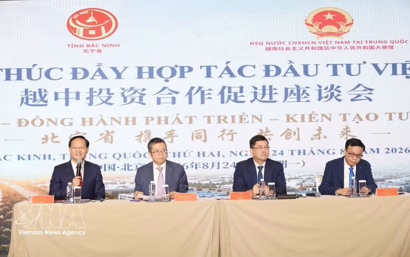 北宁省和越南驻中国大使馆代表在座谈会上发表讲话。图：越通社