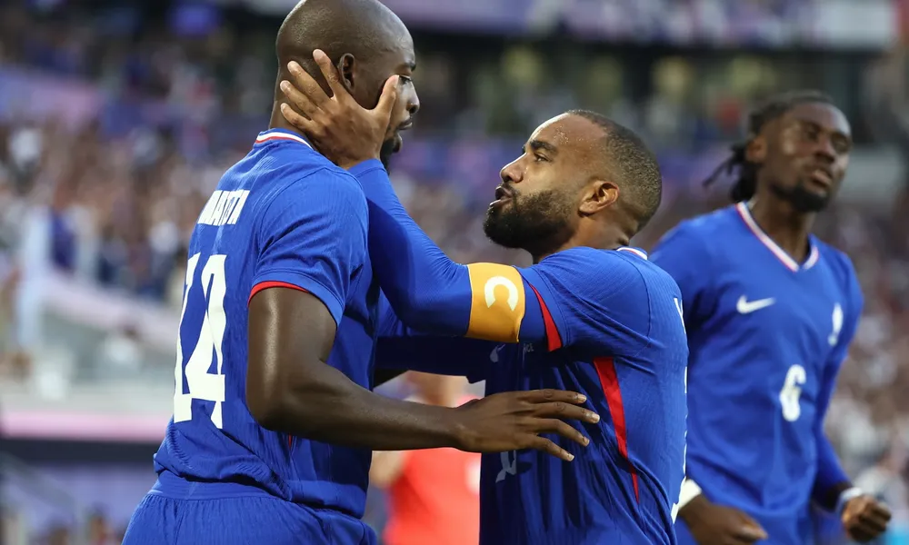 Jean-Philippe-Mateta-_left_-celebrates-with-Alexandre-Lacazette-after-scoring-France’s-first-goal-in.jpg