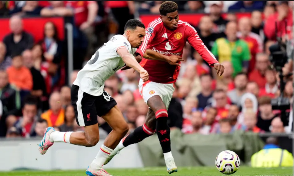 Marcus Rashford battles with Liverpool’s Trent Alexander-Arnold in a game where he extended his goalless run to 12 matches for club and country.png