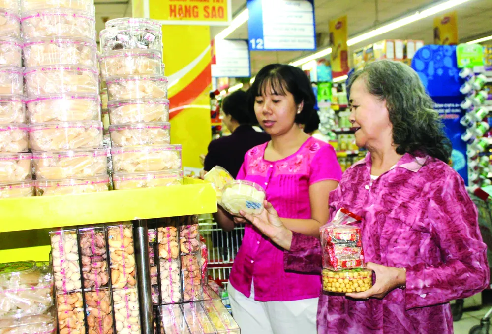 Bắt đầu giảm giá hàng hóa tết trên cả nước ảnh 1