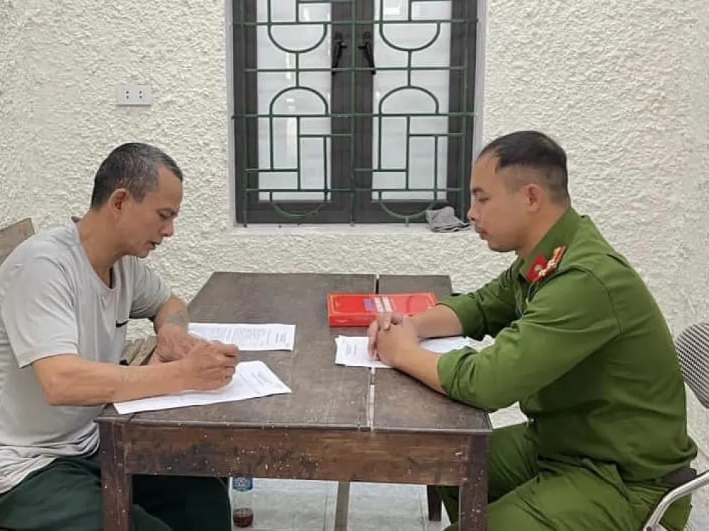 Trần Văn Quý tại cơ quan công an