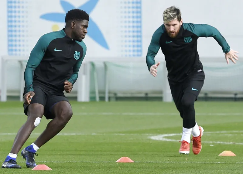 Những bài tập Barca sẽ giúp Samuel Umtiti (trái) ngăn cản Lionel Messi. Ảnh: Getty Images 