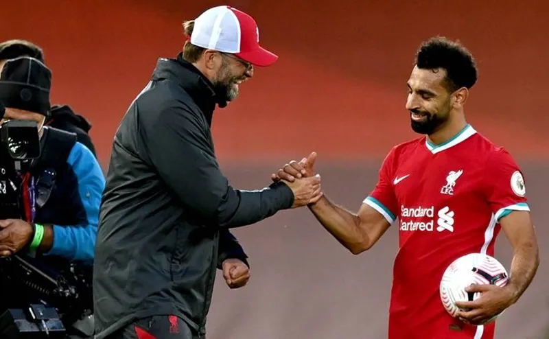 HLV Jurgen Klopp khẳng định Mohamed Salah vẫn đanh hạnh phúc. Ảnh: Getty Images 