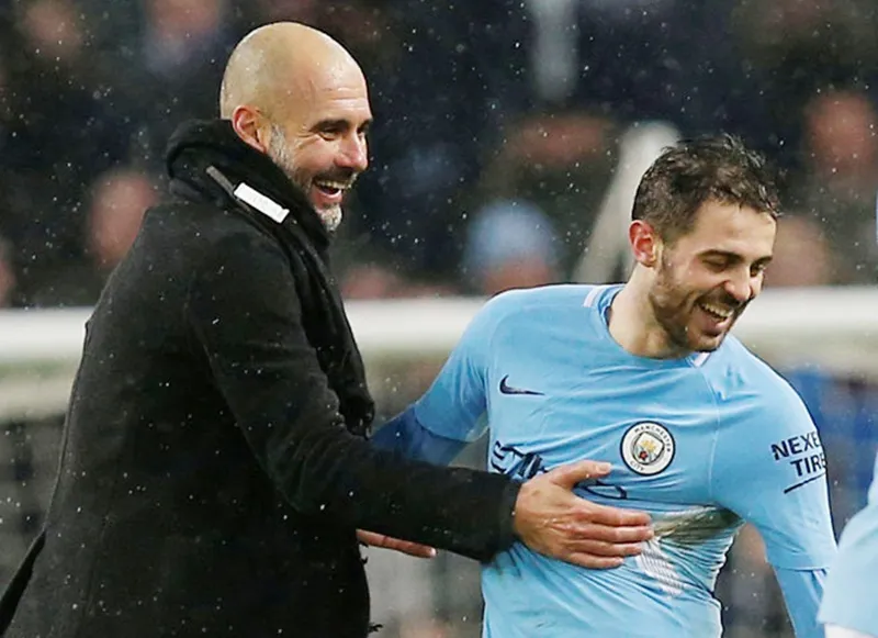 HLV Pep Guardiola và Bernardo Silva luôn duy trì mối quan hệ tốt. Ảnh: Getty Images
