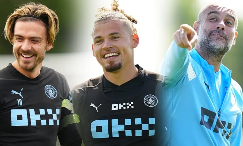 HLV Pep Guardiola chào đón Jack Grealish cùng tiền vệ tân binh Kalvin Phillips (phải).