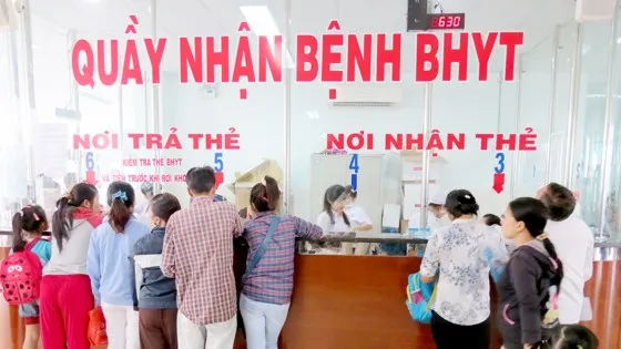 Bệnh nhân BHYT khám bệnh tại một cơ sở khám chữa bệnh.  Ảnh: PHẠM THỌ