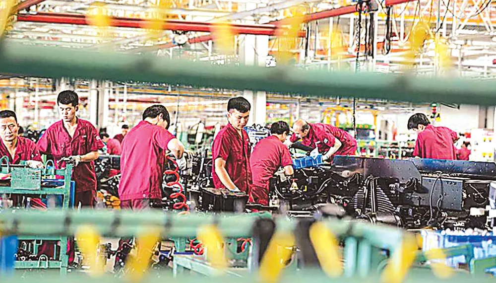 Đến thời điểm này, Trung Quốc là nền kinh tế lớn duy nhất  được dự báo tăng trưởng trong năm nay                                                                                                          Ảnh: WALL STREET JOUNAL