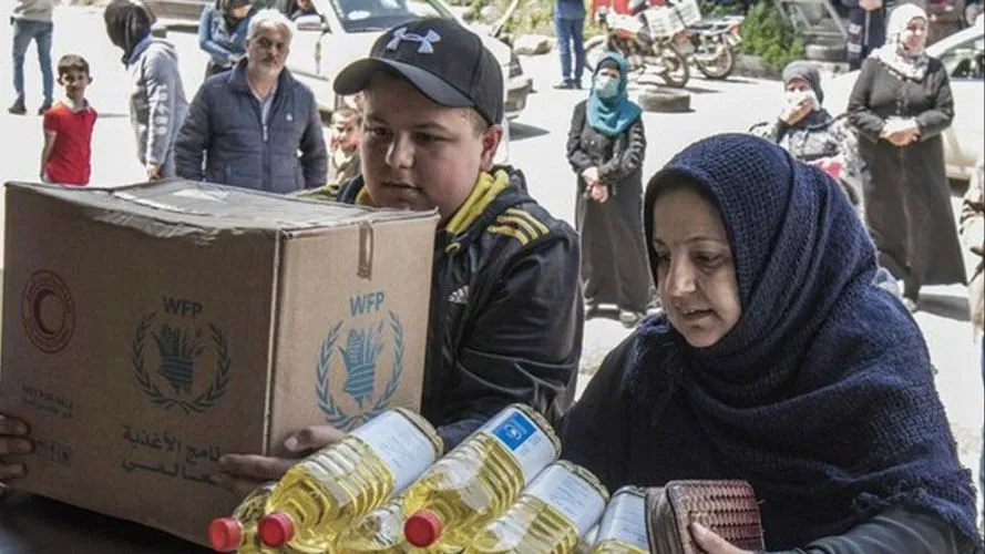 Một gia đình ở Syria nhận trợ cấp lương thực hàng tháng từ Chương trình Lương thực Thế giới (WFP). Ảnh : WFP
