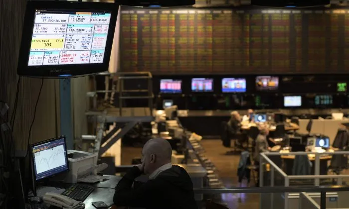 A broker looks at a screen at the Buenos Aires Stock Exchange in the financial district of Buenos Aires on Aug. 20, 2019 after Argentina's President Mauricio Macri swore Hernan Lacunza in as the country's new economy minister. Lacunza made stabilizing the