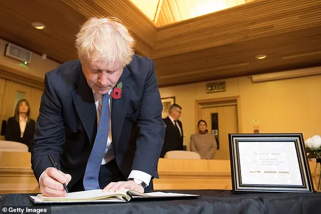 Prime Minister Boris Johnson signs a book of condolence at Thurrock Council on October 28
