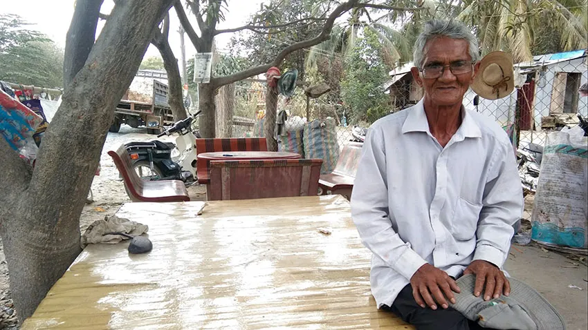 Pa Ven, a village chief in Kampong Speu, Cambodia, says his people can only pay back debts because their children work in factories. (Photo by Shaun Turton) © AP