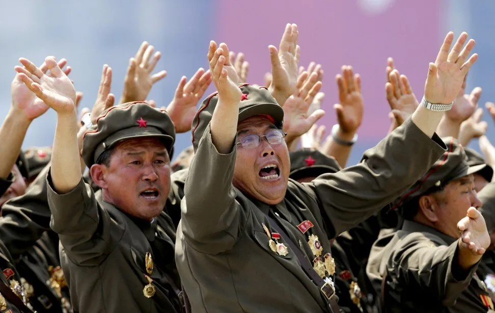 War veterans shout slogans to North Korean leader Kim Jong-un during a 2013 parade to mark the 60th anniversary of the signing of a truce in the Korean war. Photo: Reuters