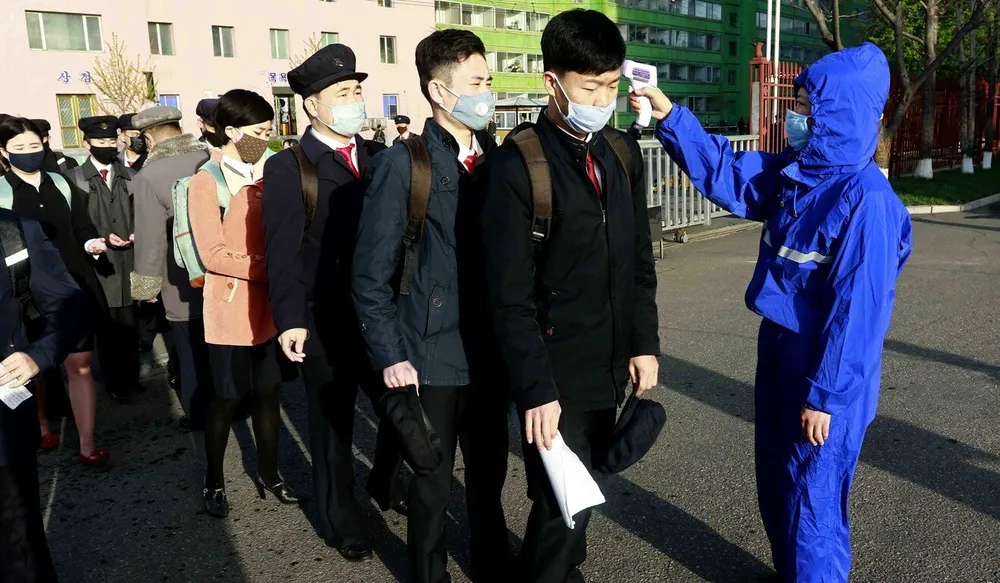 Students have their temperature checked at the Kim Chaek University of Technology in Pyongyang on April 22, 2020. Photo: AP