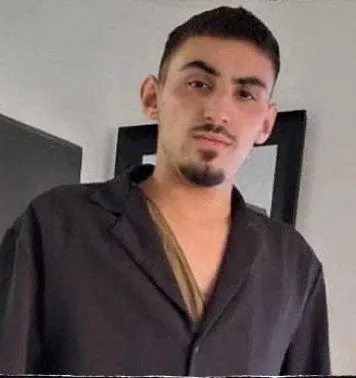 Rom Braslavski đang làm nhân viên bảo vệ tại lễ hội âm nhạc Nova khi bị bắt làm con tin (Ảnh: Bản tin Bring Them Home Now)