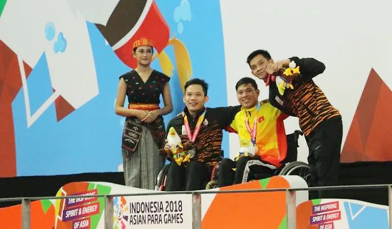 Võ Thanh Tùng (áo vàng) xuất sắc mang về tấm HCV cho Đoàn Việt Nam trong ngày thi đấu thứ tư. Ảnh: Vietnam+