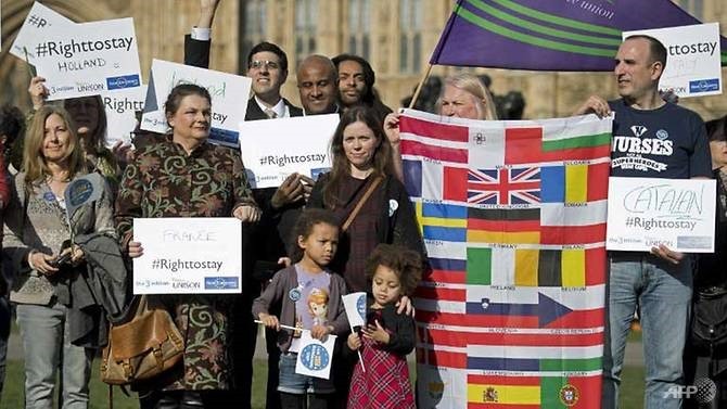European workers including nurses, social workers and teaching assistants demonstrate outside the Houses of Parliament in London on February 20, before lobbying members of Parliament over their right to remain in the UK. - AFP/VNA Photo 