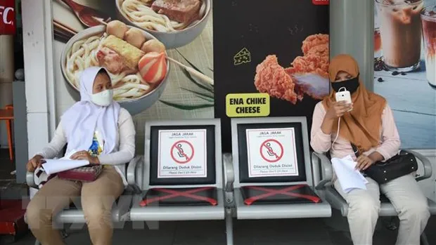 Người dân tại Jakarta, Indonesia. Ảnh: TTXVN