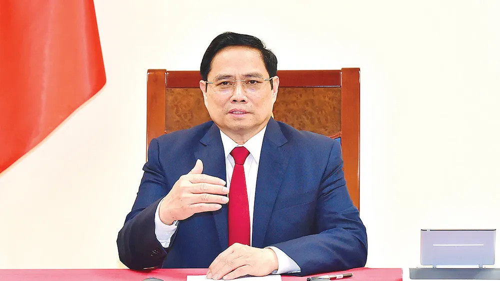 Thủ tướng Phạm Minh Chính điện đàm với Tổng Giám đốc WHO Tedros Adhanom Ghebreyesus. Ảnh: Chinhphu.vn