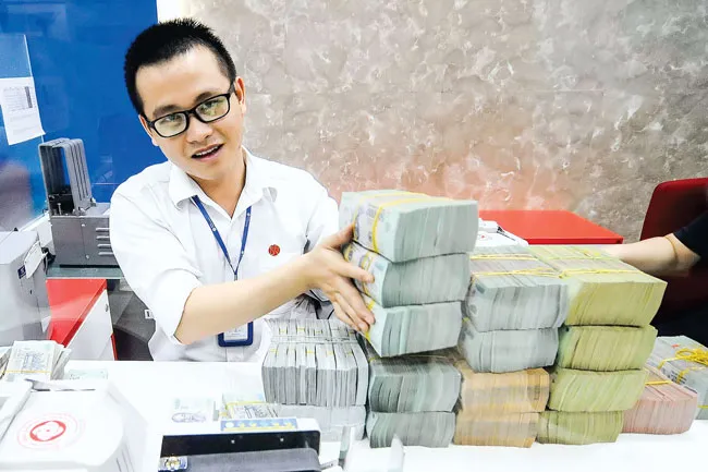 Tăng vốn điều lệ ngân hàng: Cuộc đua lắm gian nan ảnh 1