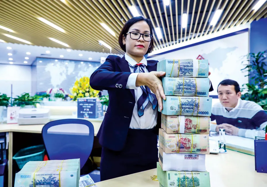 Khi nhà băng LO… nhiều tiền mặt ảnh 1