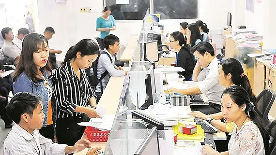 Giải quyết hồ sơ đăng ký kinh doanh tại Sở Kế hoạch và đầu tư TPHCM Ảnh: CAO THĂNG