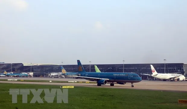 Máy bay của Vietnam Airline đỗ tại sân bay Nội Bài. (Ảnh: Huy Hùng/TTXVN)