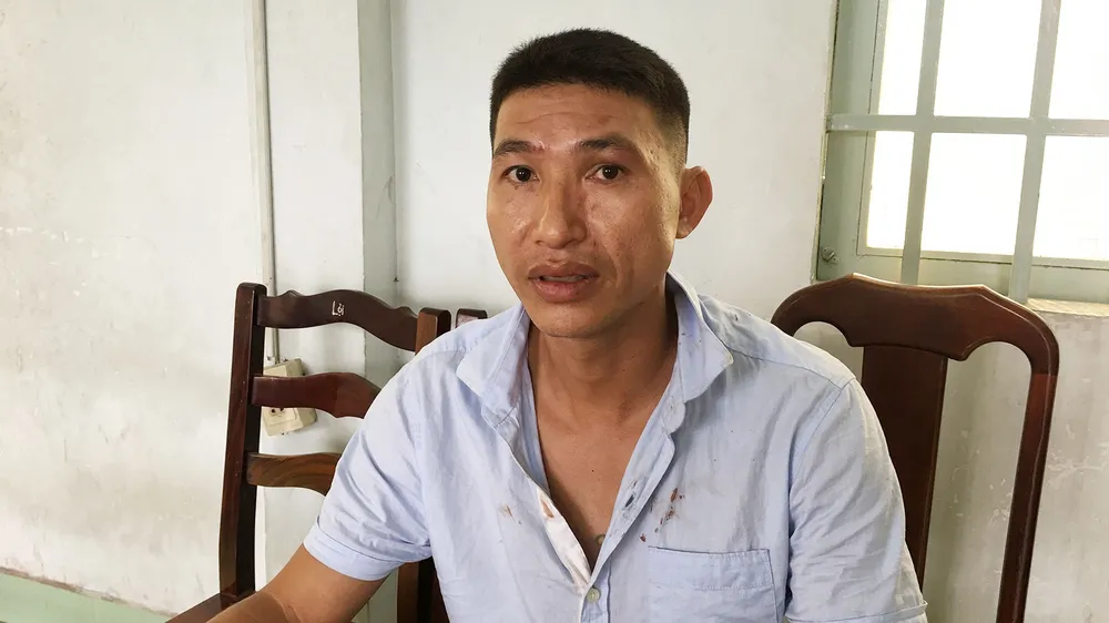 Đối tượng Nguyễn Quang Minh tại cơ quan công an. Ảnh: CHÍ THẠCH