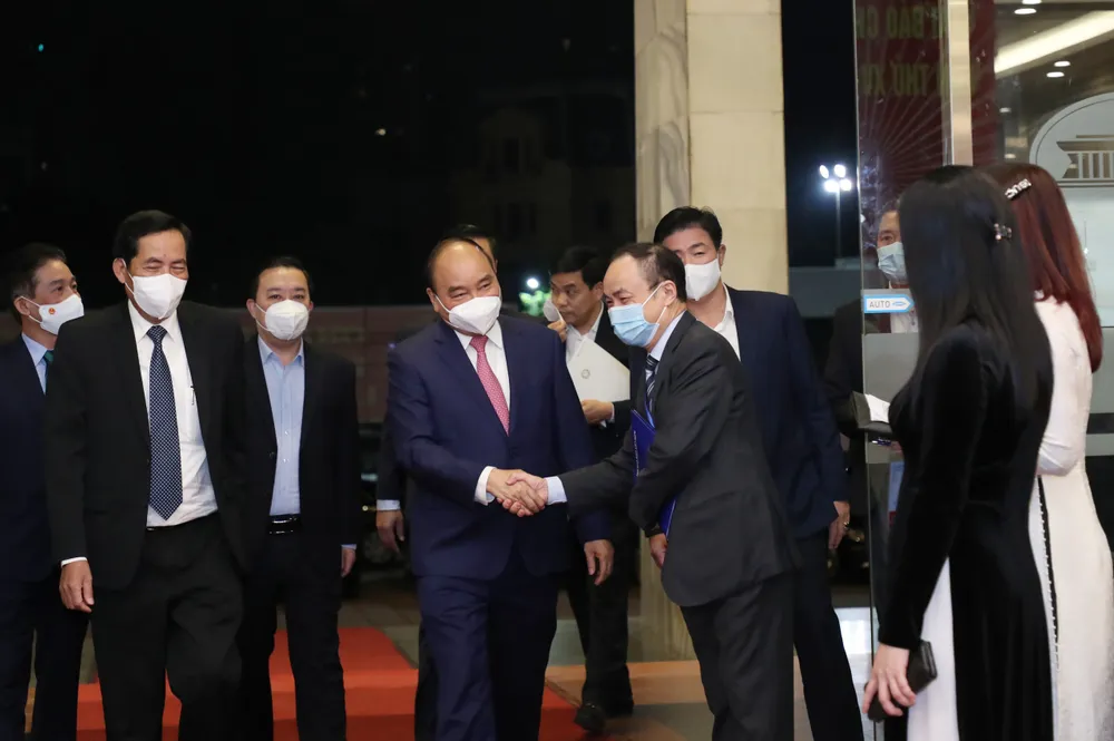 Chủ tịch nước Nguyễn Xuân Phúc: Báo chí tiên phong cung cấp kịp thời thông tin về dịch bệnh Covid-19 ảnh 2