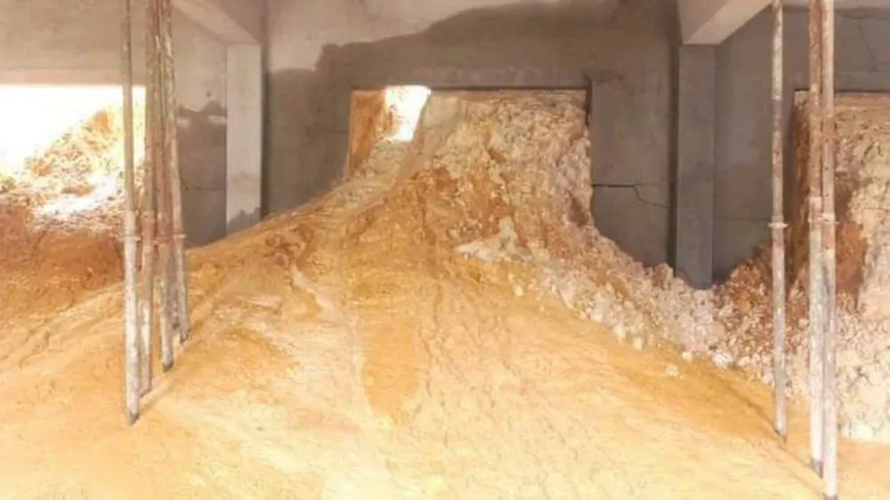 Mud and debris have spilled into the under-construction two-story classroom building.