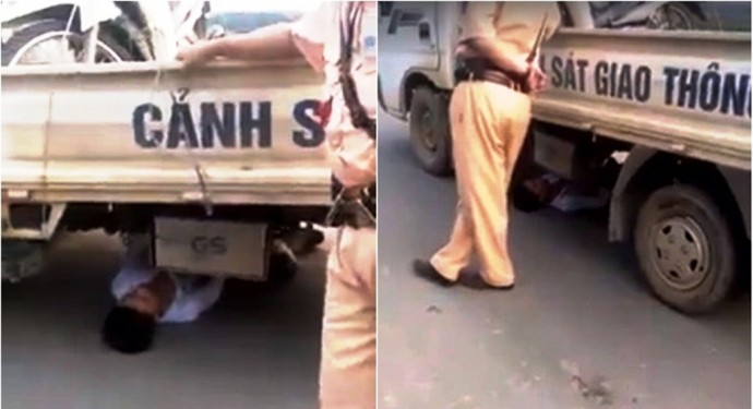 鑽入交警車底耍賴的男青年。（圖片來源：互聯網）