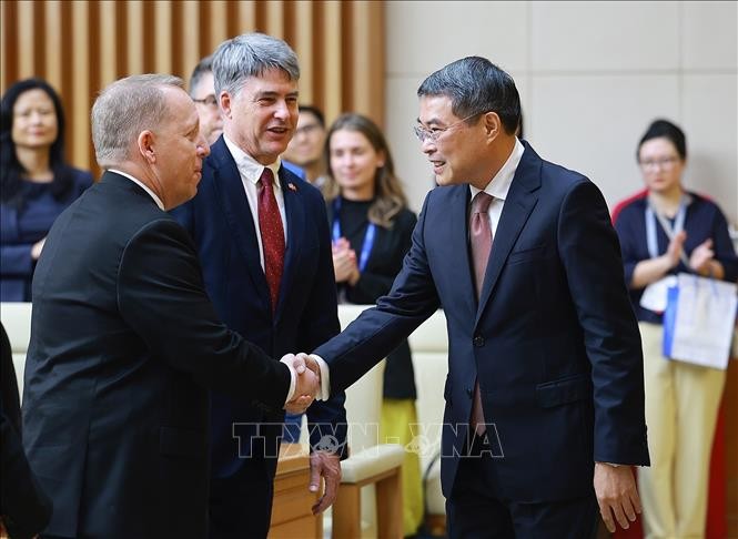 政府总理黎明兴会见并与美国-东盟商务理事会高级企业代表团举行工作会议。图：杨江/越通社