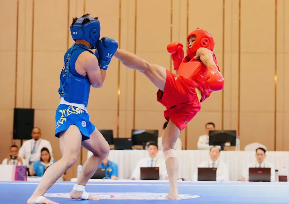 Bùi Trường Giang (đỏ) là một trong những tuyển thủ từng dự ASIAD 18-2018 cách đây 5 năm. Ảnh: DŨNG PHƯƠNG