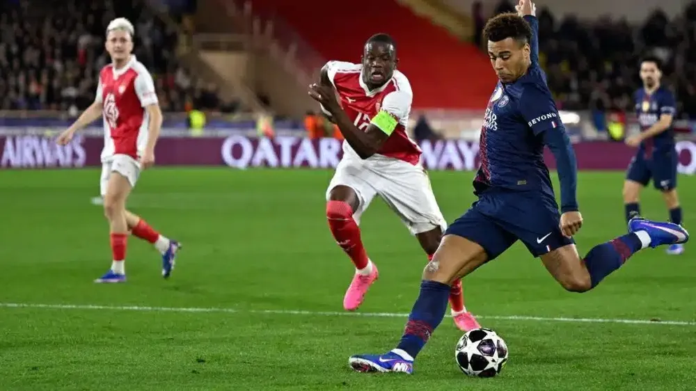 Desire Doue lập cú đúp giúp PSG thắng ngược Monaco tại play-off lượt đi. Ảnh: Getty Images